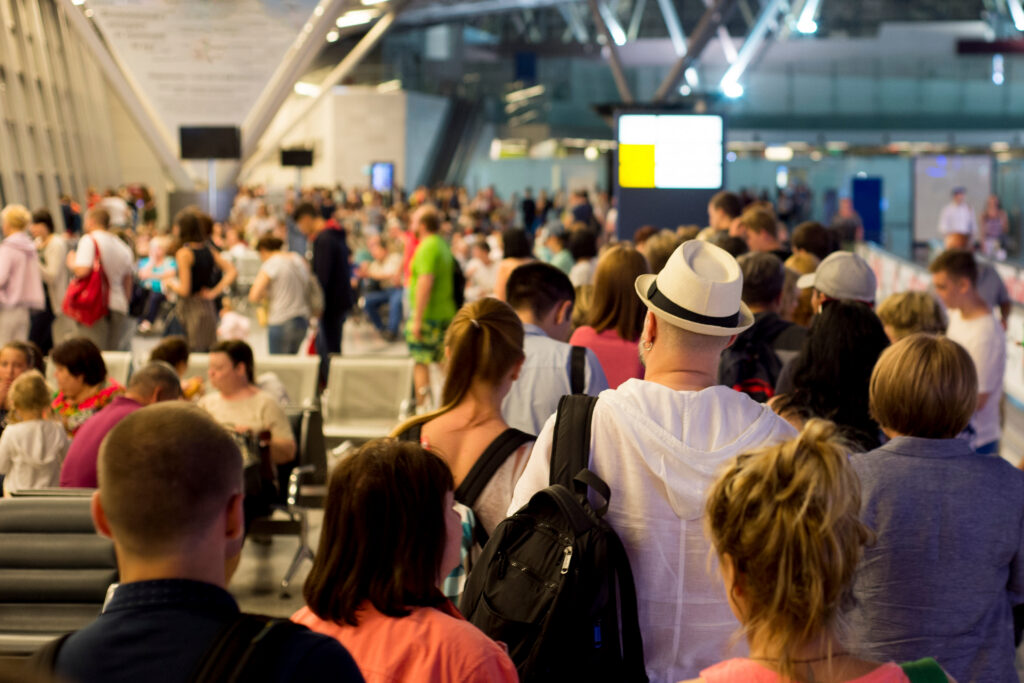 Travelers in long lines waiting to get through security 